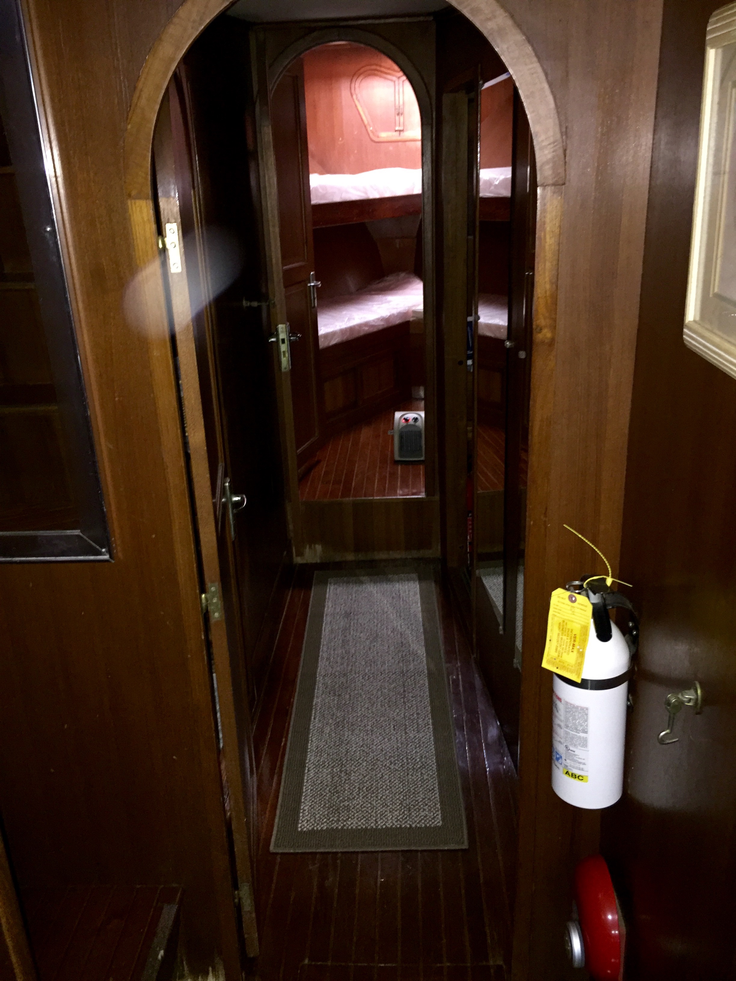 The forward passage opens toward the guest cabins.