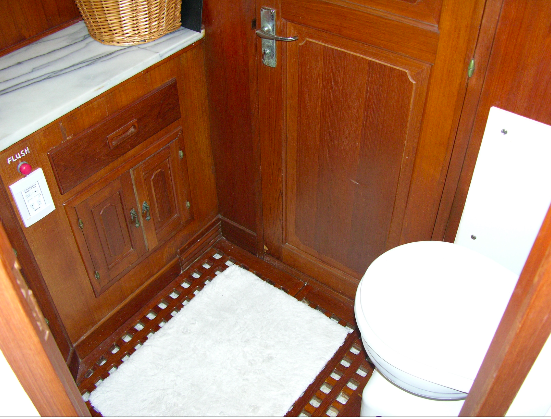 Compact cabinetry and fixtures in the middle head.