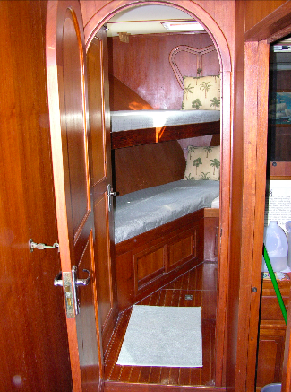 The forward stateroom's compact bunk arrangement.