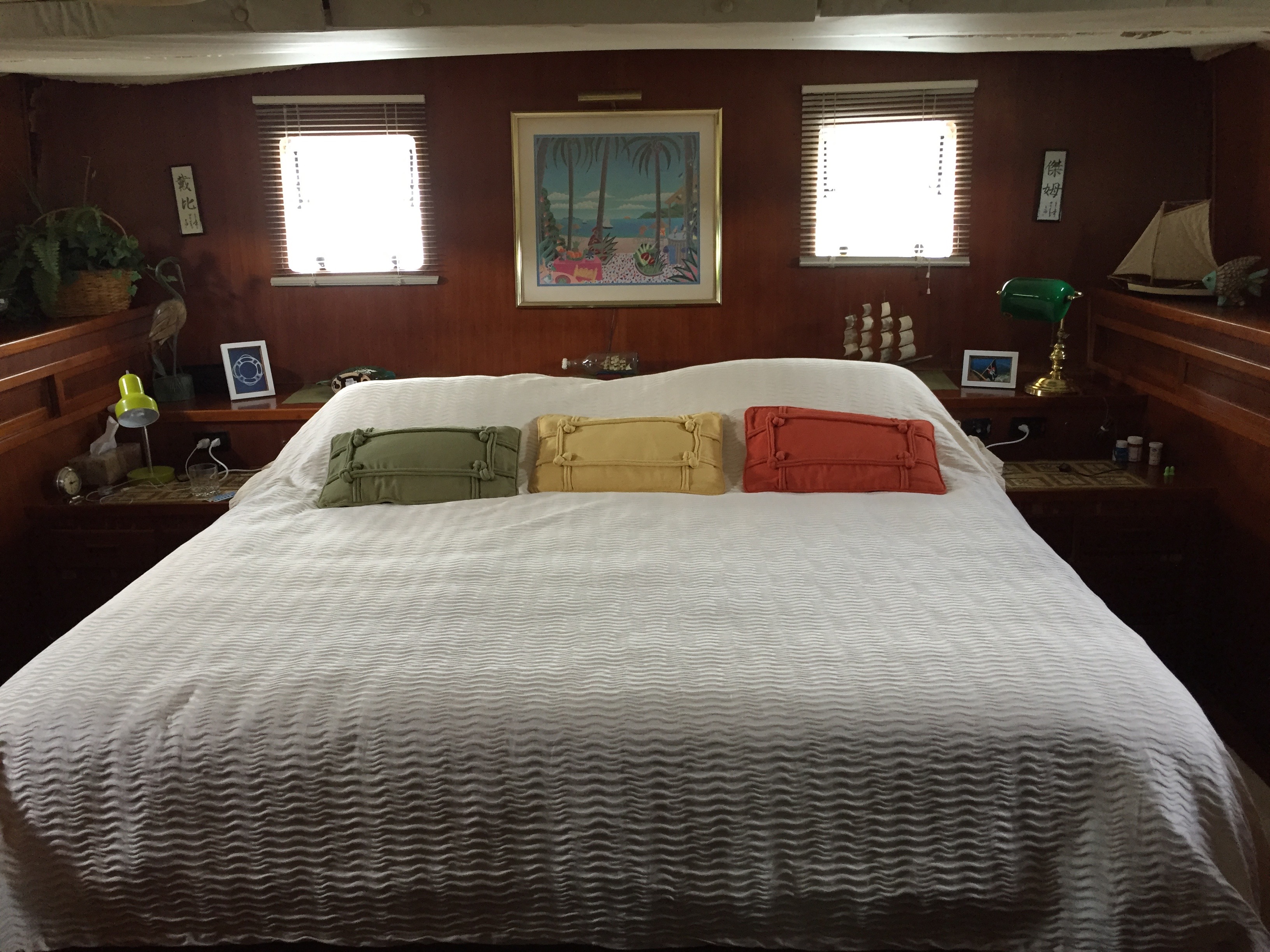 The full-width aft stateroom and its built-in furnishings.