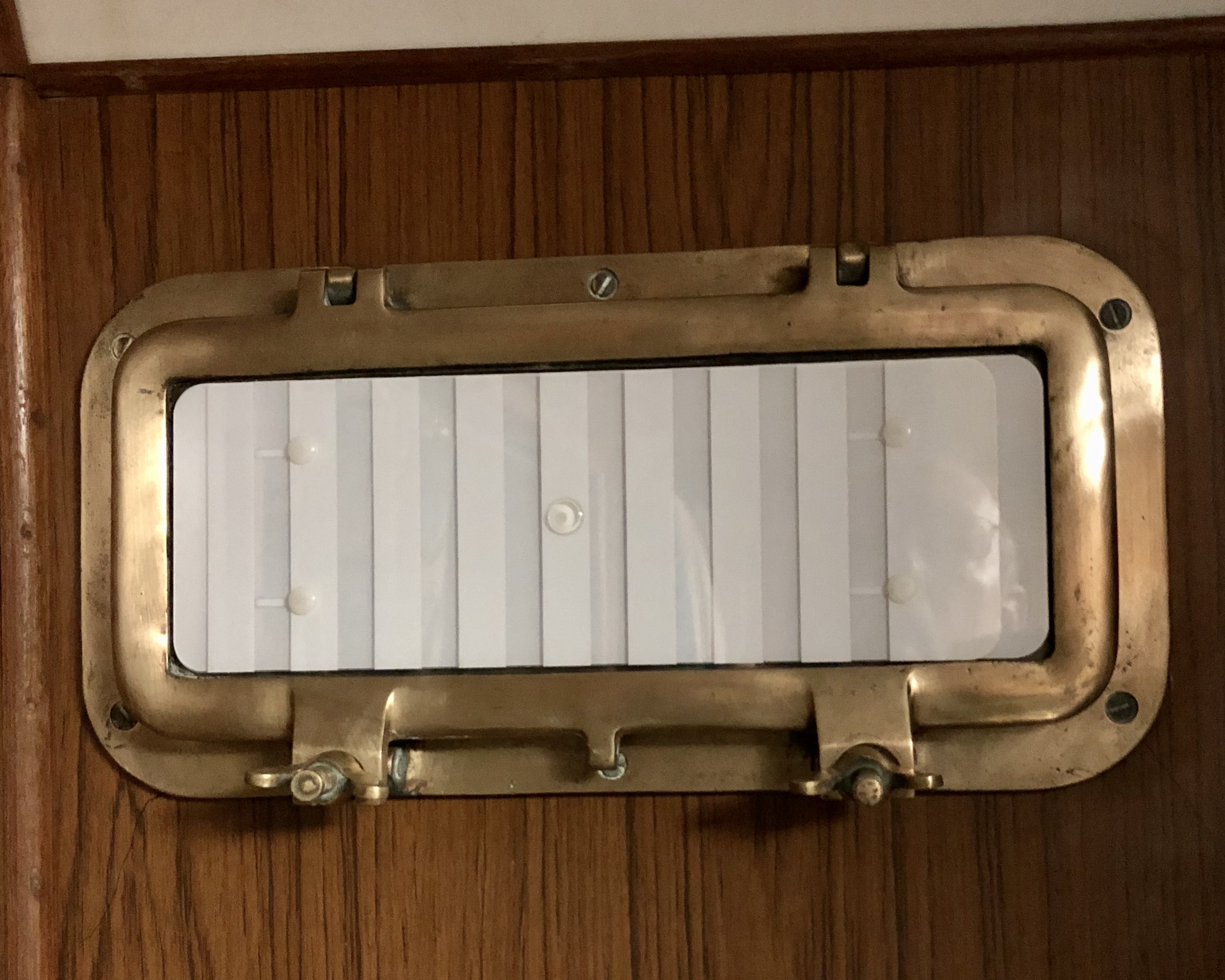 A traditional opening port brings light and air below.
