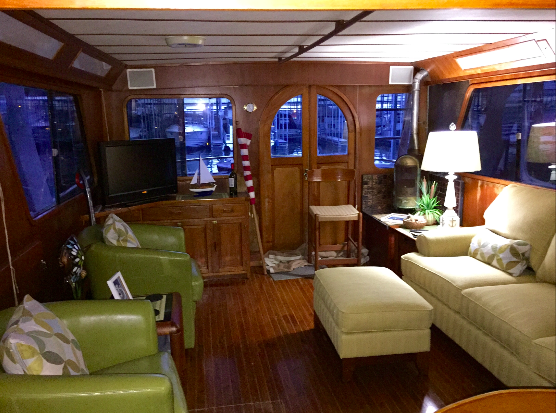 The salon looking aft toward the curved teak doors.