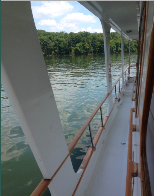 A protected side deck connecting bow and stern.