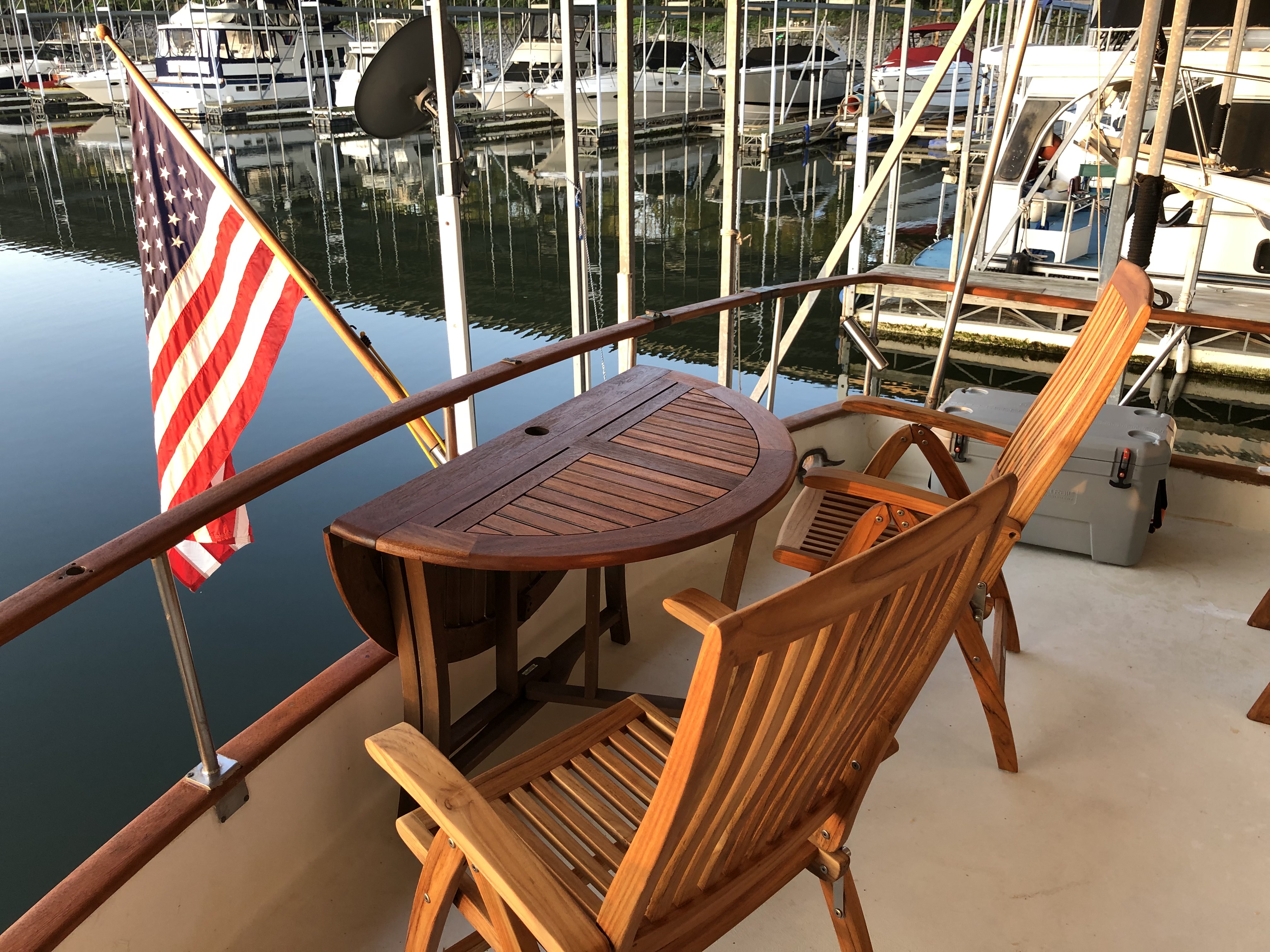 Teak doors, ship's bell, and the ladder to the upper deck.