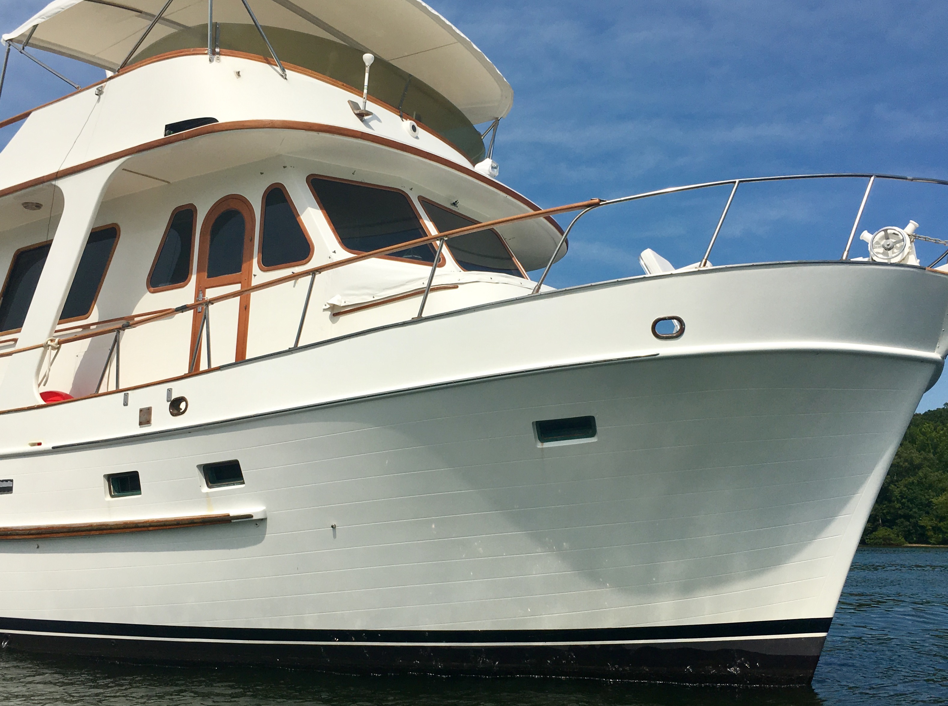 A close bow view of the high, full hull.