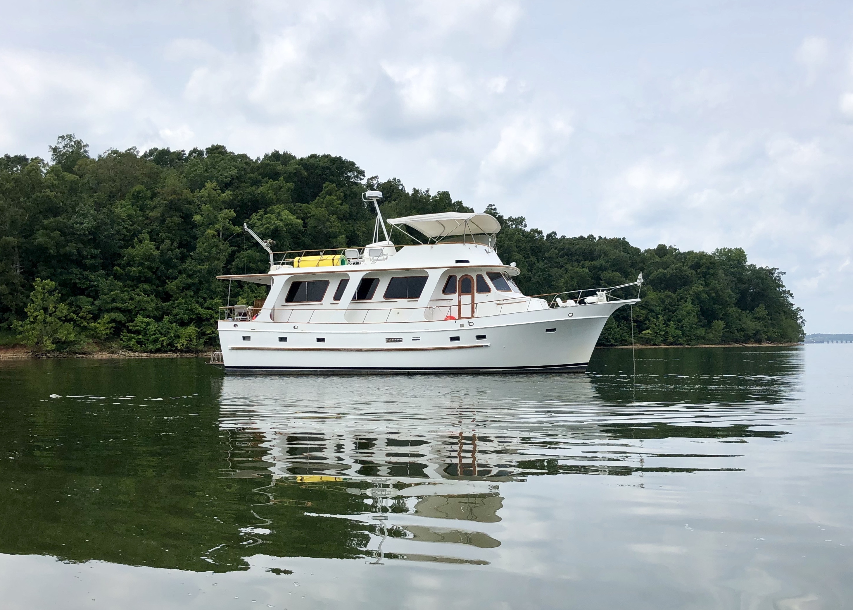 Hunky Dory resting at anchor on calm water.