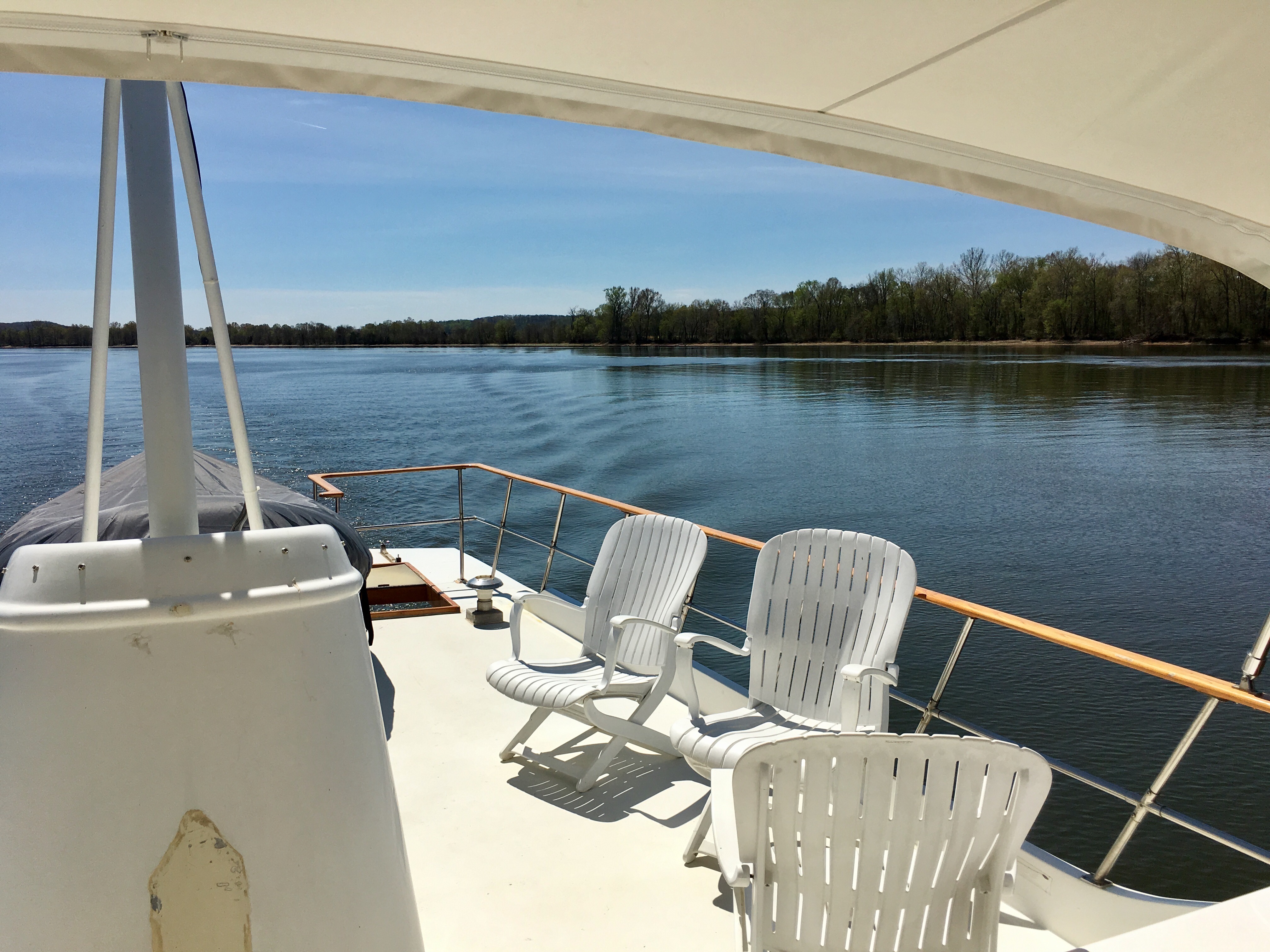 Open upper-deck seating beneath the canvas top.